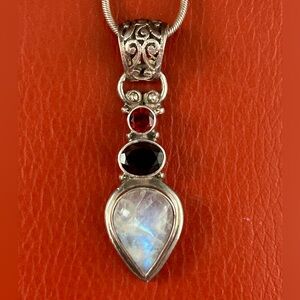 Sterling silver moonstone & garnet pendant necklace. Signed 925.